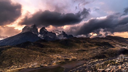 Image snow covered mountain under cloudy sky during daytime