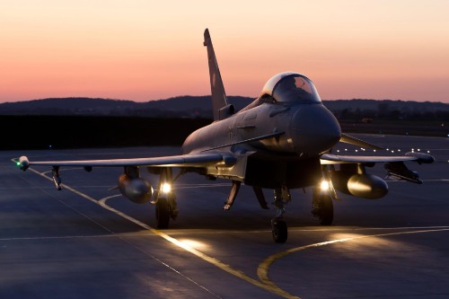 Image gray fighter plane on airport during daytime