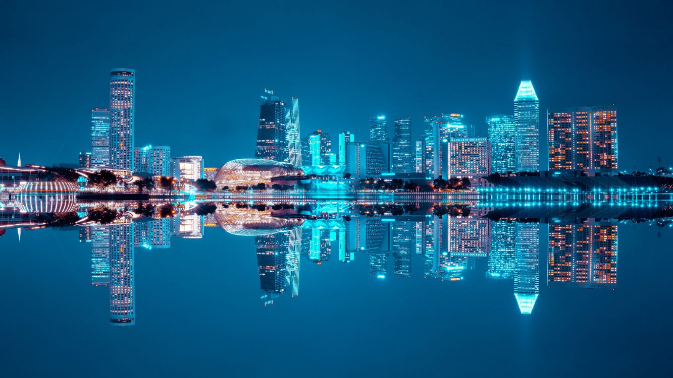 City Skyline Across Body of Water During Night Time. Wallpaper in 6000x3375 Resolution