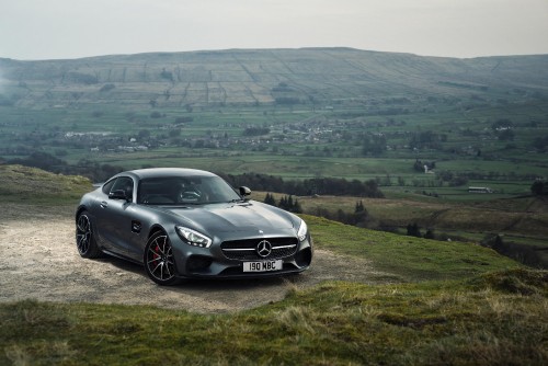 Image black mercedes benz coupe on green grass field during daytime