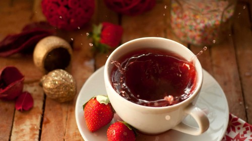 Image white ceramic teacup with red liquid