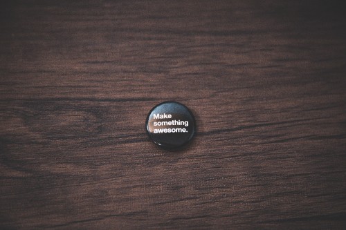 Image black round plastic lid on brown wooden table