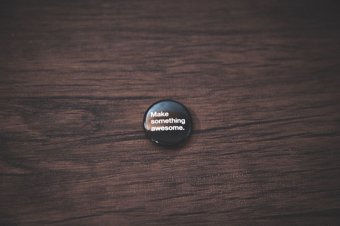 black round plastic lid on brown wooden table