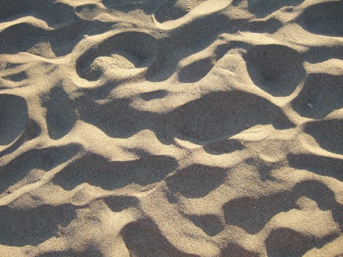 Image brown sand with black shadow