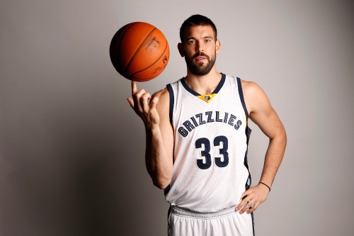 Image man in white and black tank top holding basketball