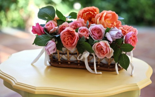 Image red roses on brown woven basket