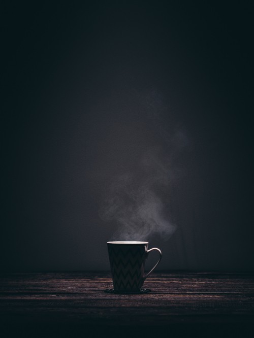 Image white and black ceramic mug with smoke