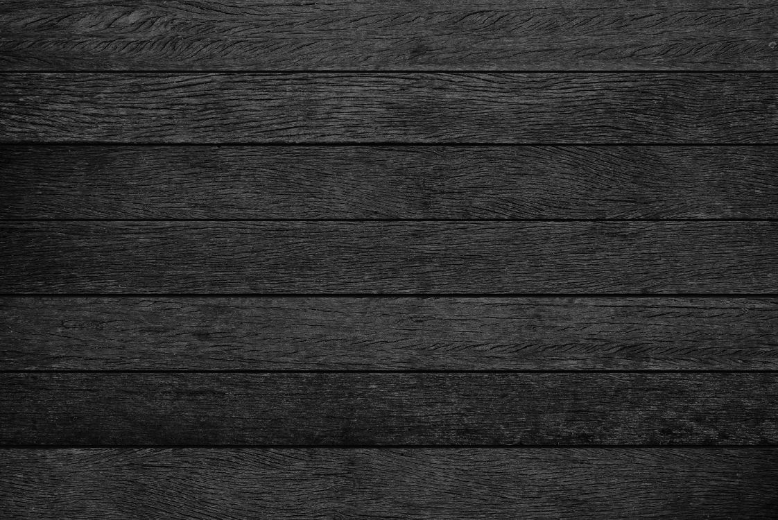 grayscale photo of wooden surface