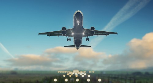 Image white and blue airplane flying during daytime