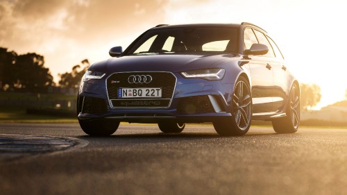 Image blue audi a 4 on road during daytime