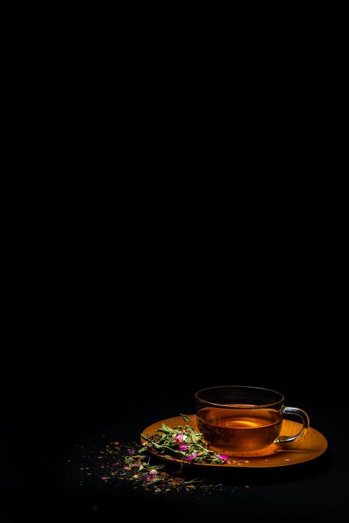 clear glass mug with brown liquid