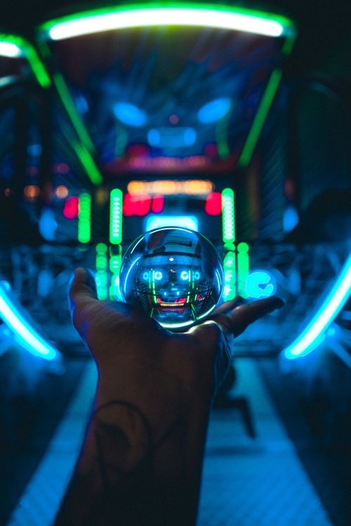 person holding clear glass ball