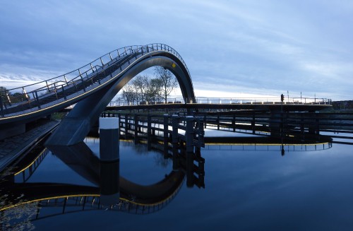 Image gray concrete bridge over body of water during daytime