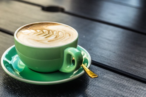 Image green ceramic mug with coffee