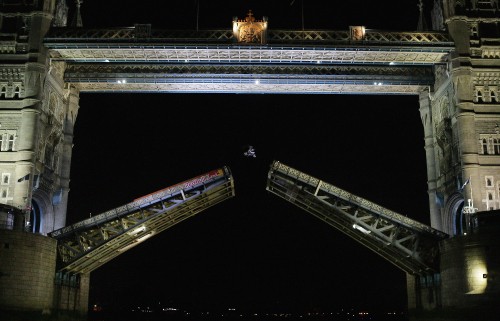 Image brown and white train on rail during night time