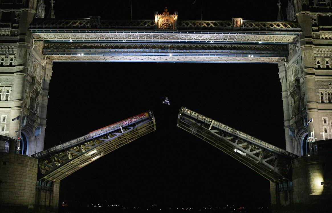 brown and white train on rail during night time