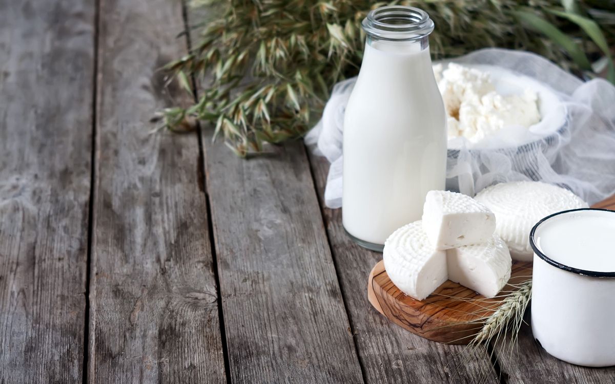 white ceramic vase on brown wooden table