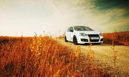 Image white bmw x series on brown grass field during daytime