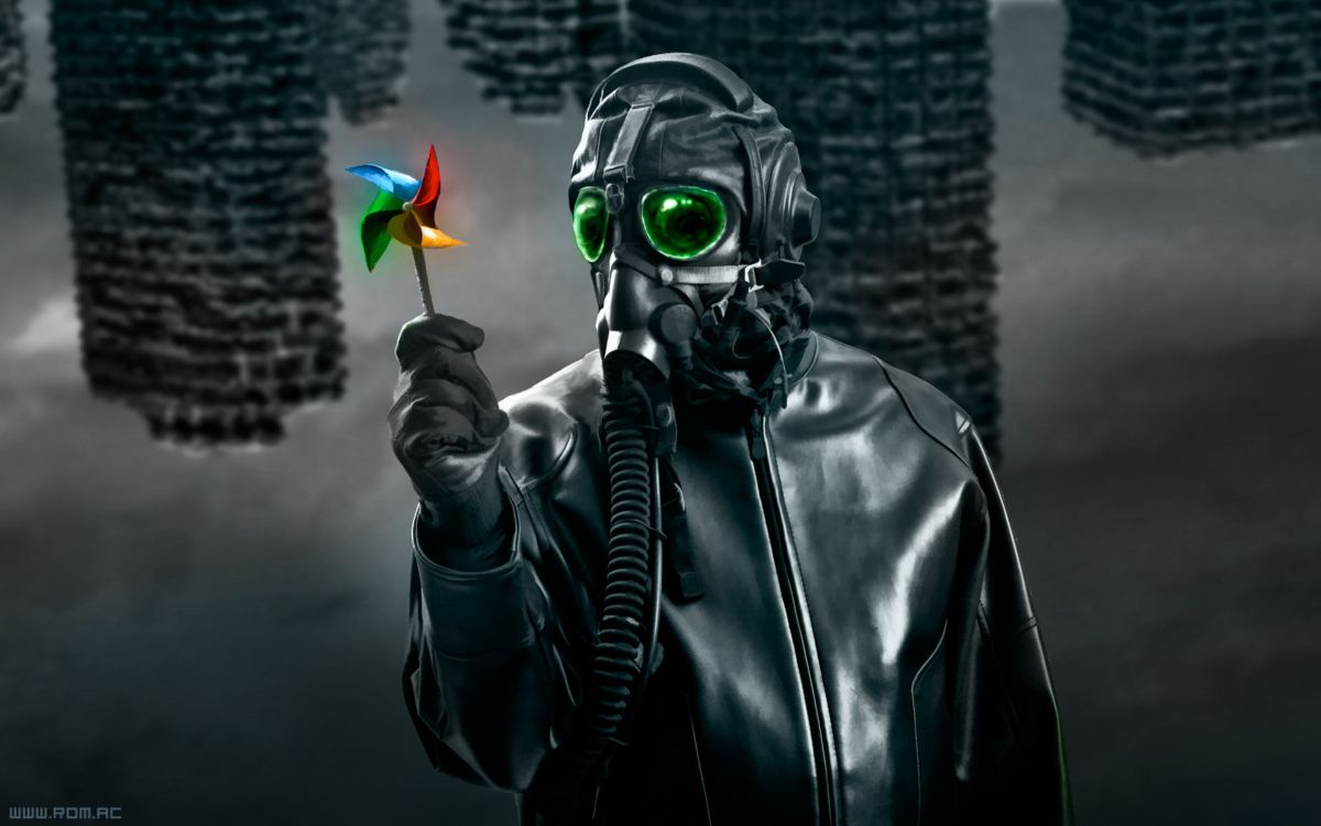 person in black leather jacket wearing green mask holding yellow and orange flower