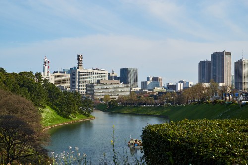 Image high rise buildings near river during daytime