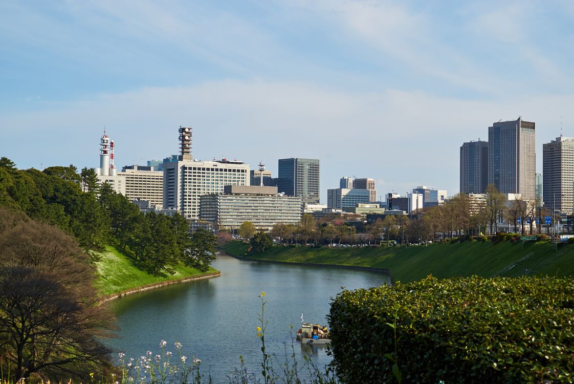 high rise buildings near river during daytime