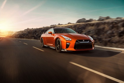 Image orange and black chevrolet camaro on road