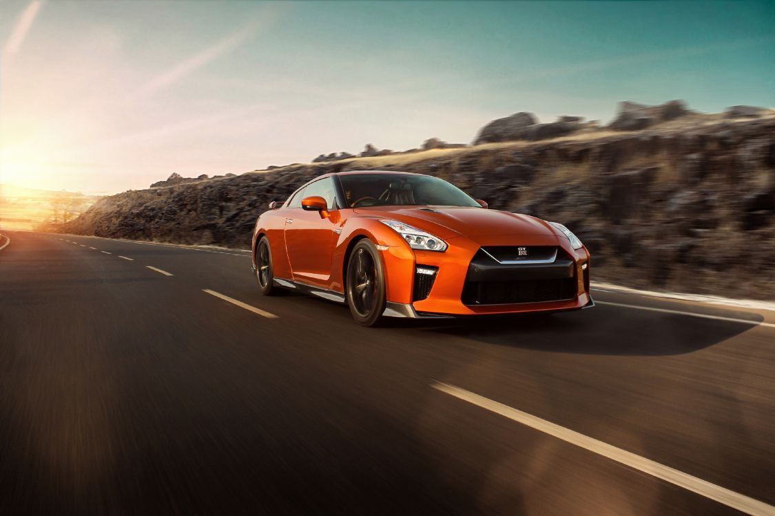 orange and black chevrolet camaro on road