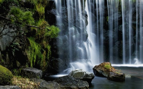 Image water falls on brown rock