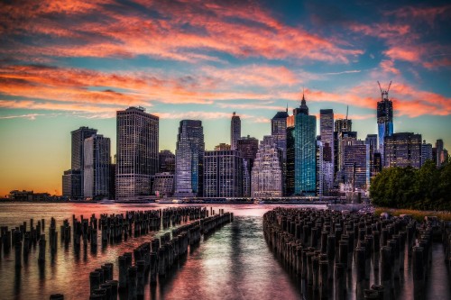 Image bridge over river near city skyline during sunset