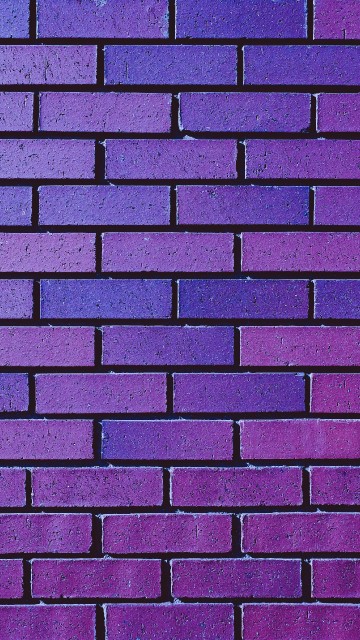Image brown and black brick wall