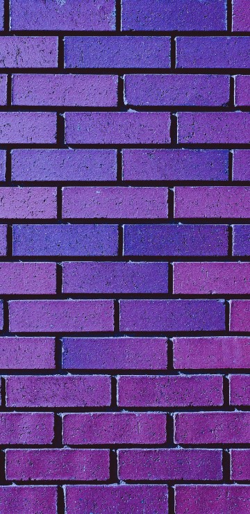 Image brown and black brick wall