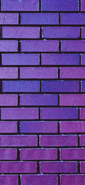 Image brown and black brick wall