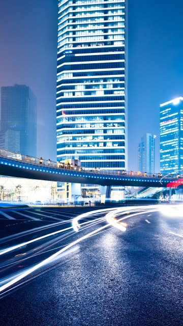 Image cars on road near high rise buildings during daytime