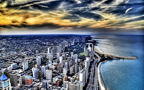 Image city skyline near body of water during daytime