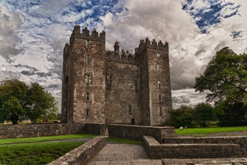 Image brown concrete castle under white clouds during daytime