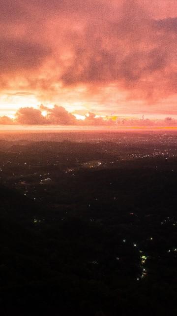 Image aerial view of city during sunset
