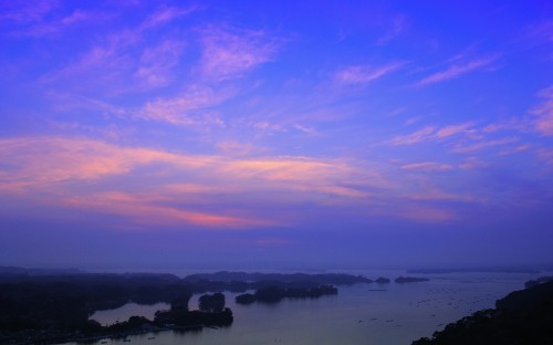 Image body of water under cloudy sky during sunset