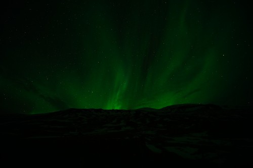 Image green aurora borealis during night time