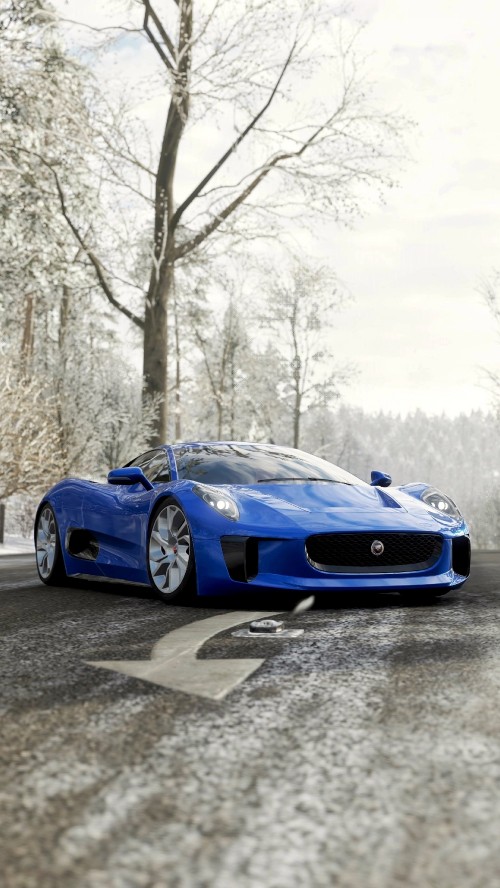 Image blue porsche 911 on snow covered ground