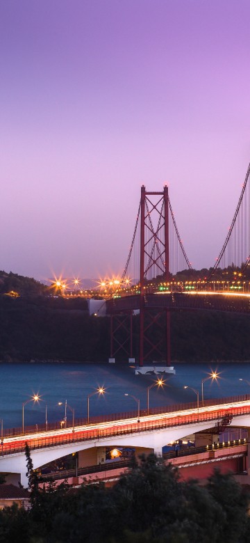 Image white concrete bridge over blue sea during daytime
