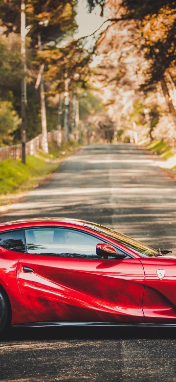 Image red ferrari 458 italia on road during daytime