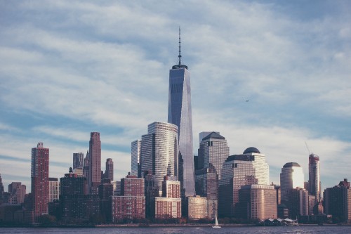 Image city skyline under white clouds during daytime