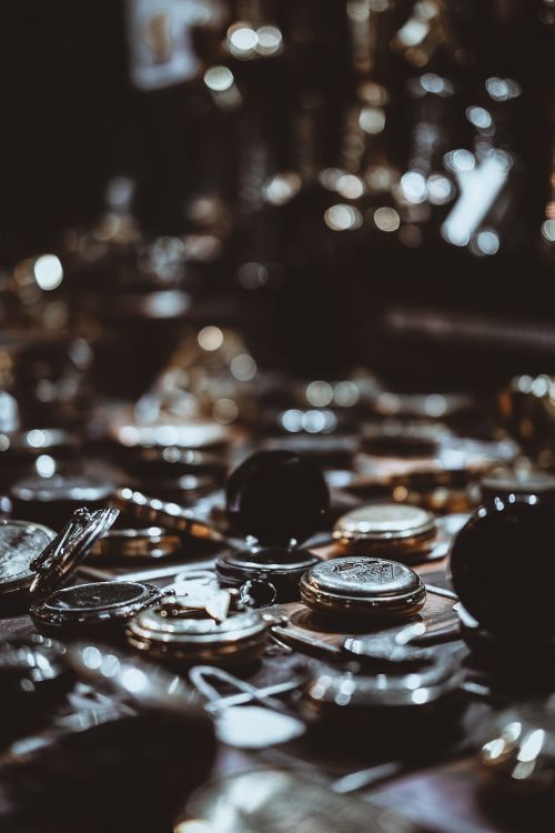 silver round coins on table