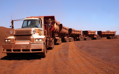 Image brown truck on brown dirt road during daytime