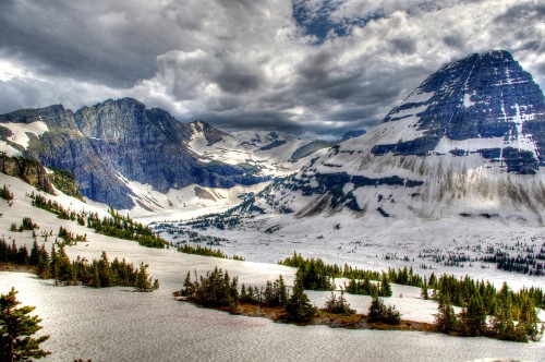 Image snow covered mountain under cloudy sky during daytime