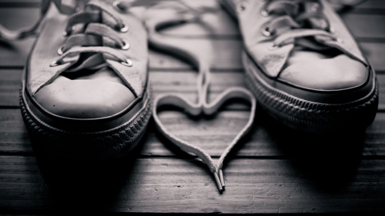 gray leather boots on wooden floor