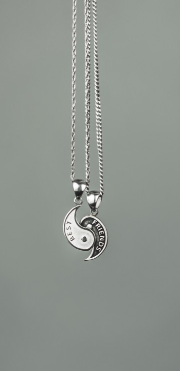 Image silver heart pendant necklace on green surface