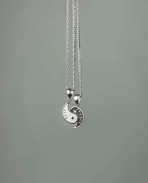 Silver Heart Pendant Necklace on Green Surface. Wallpaper in 3157x3889 Resolution