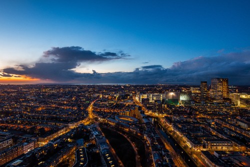 Image city with high rise buildings during night time