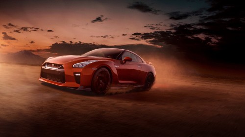 Image red porsche 911 on brown sand during sunset